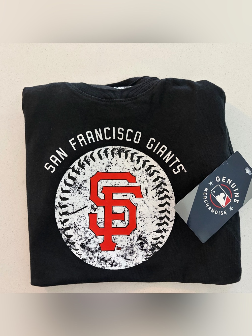 Genuine Merchandise Black Tee with White Graphic